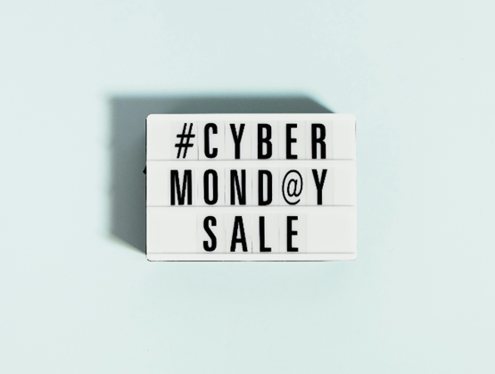 Lightbox sign displaying “Cyber Monday Sale” on a light blue background with a cast shadow