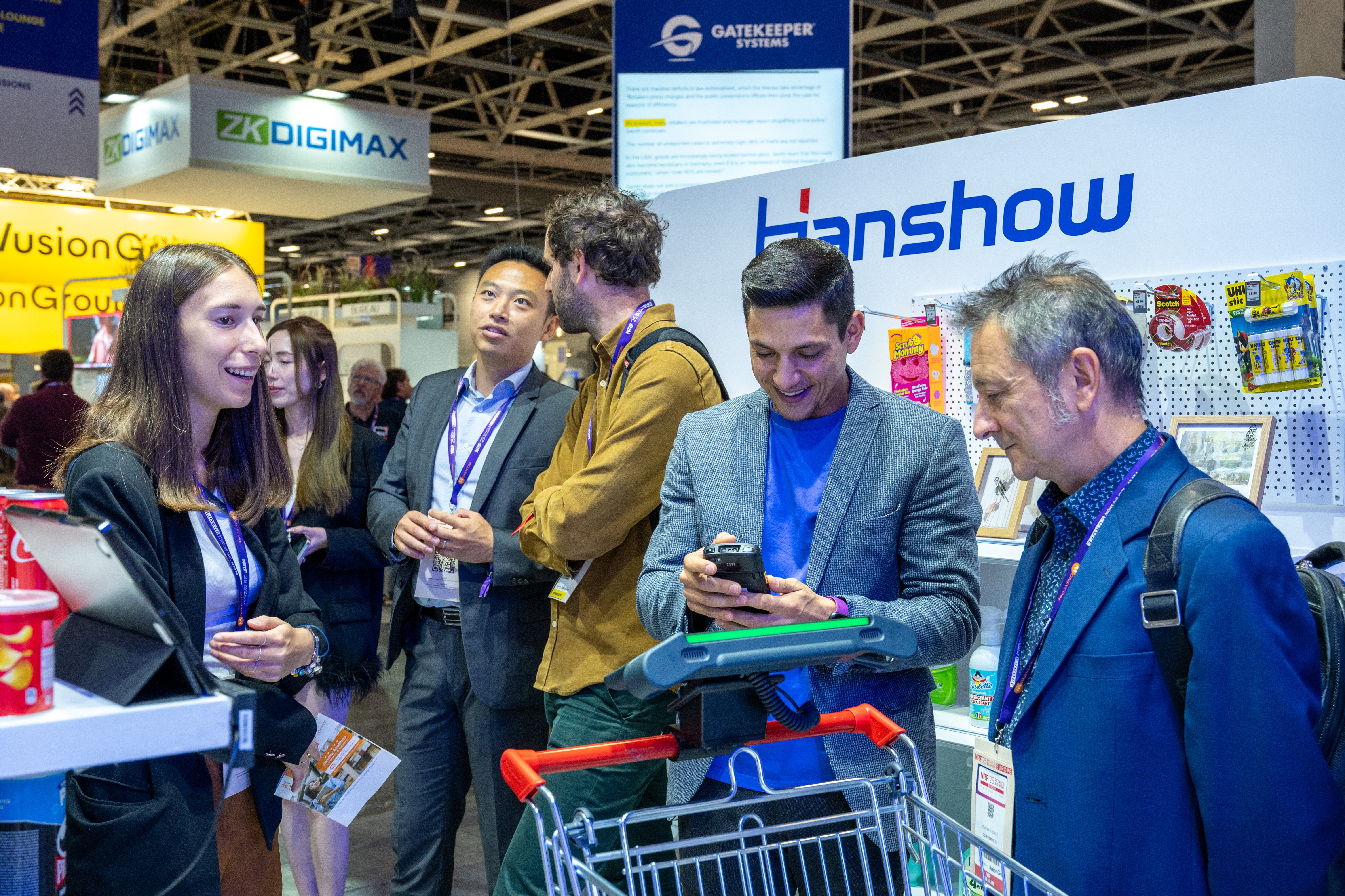 Retail professionals discovering a technology demonstration at NRF 2026: Retail’s Big Show Europe
